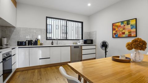 The dining table is part of the kitchen area so you can talk with the cook.