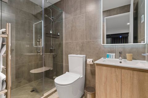 The ensuite bathroom has a vanity, toilet and shower.