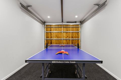 The ping-pong table is located in the garage.