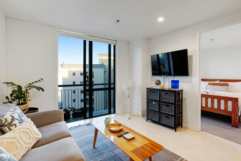 One of the bedrooms is located off the living room.