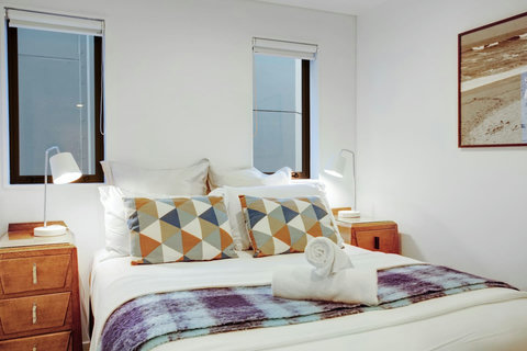 There is plenty of natural light in the bedroom.