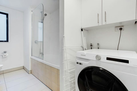 There is a handy washer and dryer combo in the bathroom.