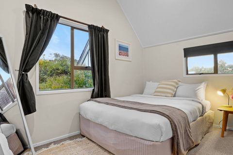 The bedroom is located upstairs and has plenty of natural light.