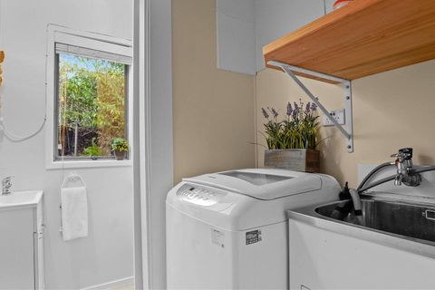 There is an extra toilet off the laundry area.