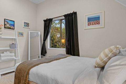 The extra shelving unit and full-length mirror are great additions to the room.