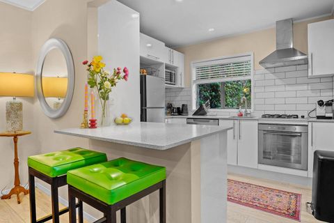 There is additional bench sitting at the kitchen island.