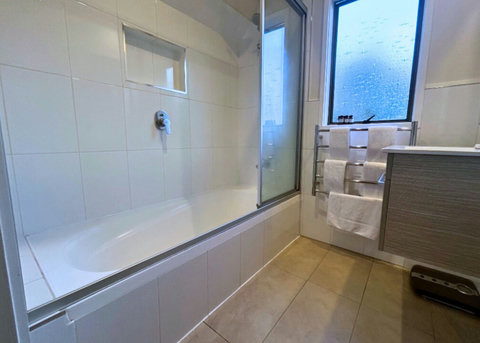 The shower is over the tub so you can enjoy either a quick rinse or a long soak.