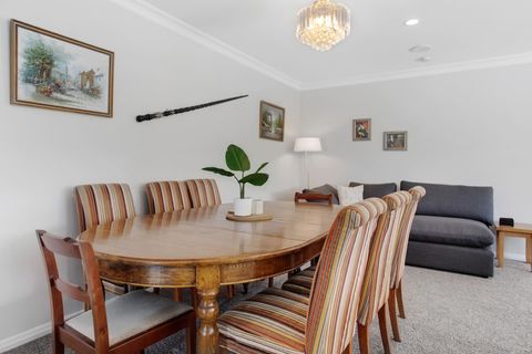 The formal dining table has plenty of seating for family meals.