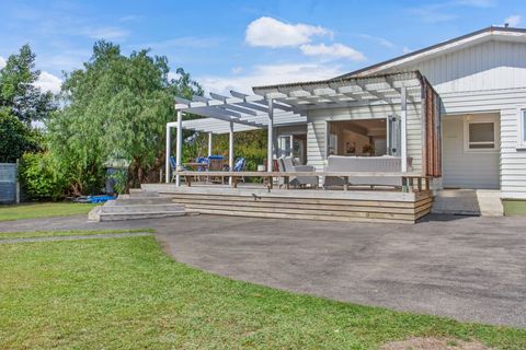 View of the deck and house from the back yard.