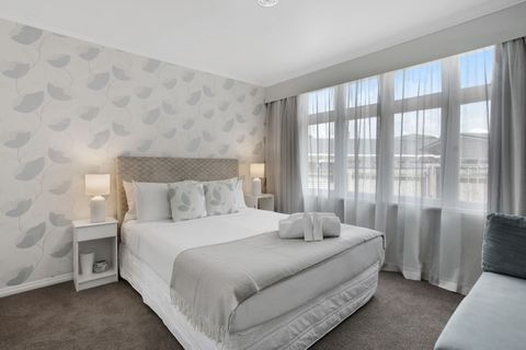 This Queen bedroom is decked out in silver tones, adding a touch of elegance.