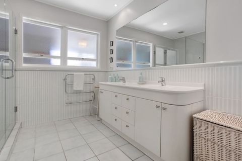 The main family bathroom has a double basin and plenty of storage in the vanity unit.