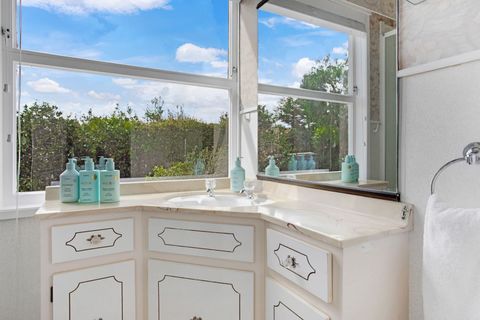 The ensuite bathroom has a large vanity unit, perfect for spreading out your own personal belongings.