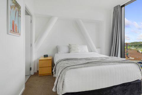 The bathroom is located off the bedroom.