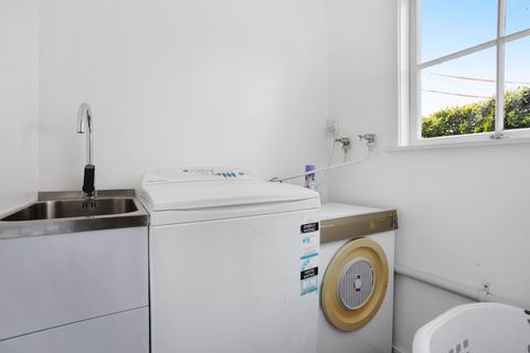 The laundry has a washing machine and dryer plus access to the backyard clothes line.