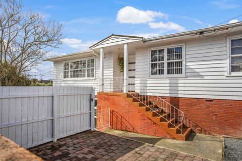 There is a parking pad with space for two cars.