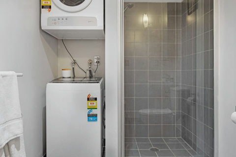 Strip off your clothes in the bathroom and chuck them straight into the washing machine.