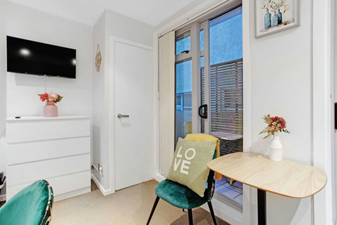 Sit on the chairs or bed to watch TV or relax with a book.