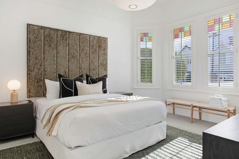 Bedrooms retain some of the original features from its original build with stained glass with elevated modern touches