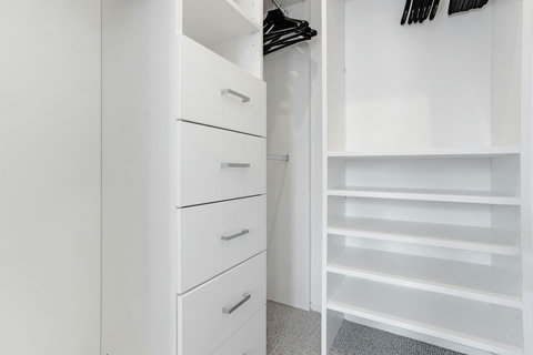 There is plenty of storage in the walk-in wardrobe for all your personal belongings.