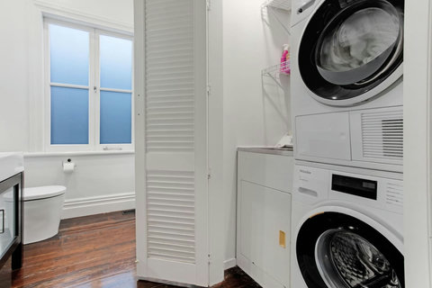 There is a handy washing machine and dryer in the bathroom cupboard.