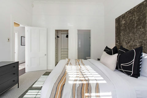 This bedroom has a King-sized bed with ensuite bathroom and walk-in wardrobe.