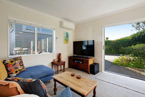 Relax in the living room area and watch TV or enjoy the open ranch slider.