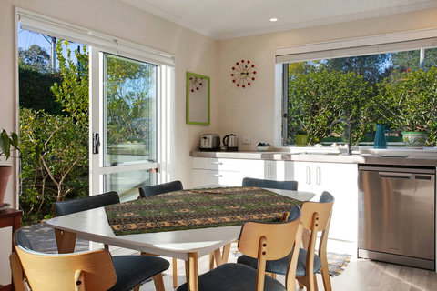 You can open the ranch sliders to enjoy the indoor/outdoor flow into the kitchen/dining area.