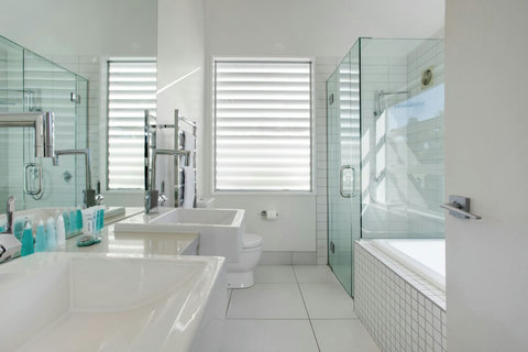 The ensuite bathroom is a very large room with the bathtub, separate shower, double vanities and toilet.