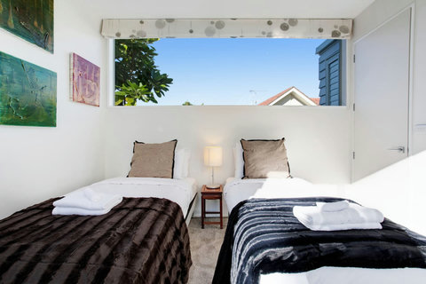 With the large full-length window there is plenty of light in this bedroom.