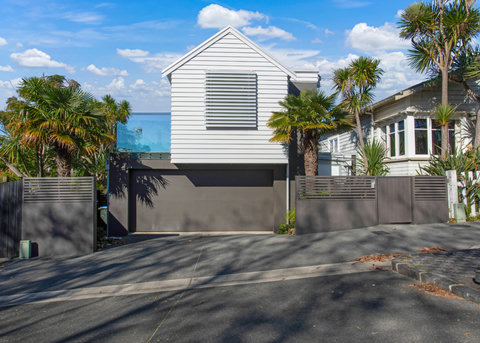 The front of the house gives you a hint of the inside modern home.