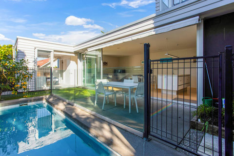 The house opens up on the backyard from both the living area and ground floor bedroom.