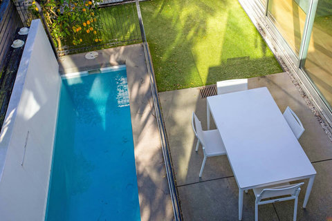 Birds eye view of the pool and outdoor dining area.