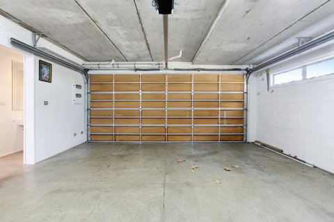 The garage has room for two vehicles to be parked securely.