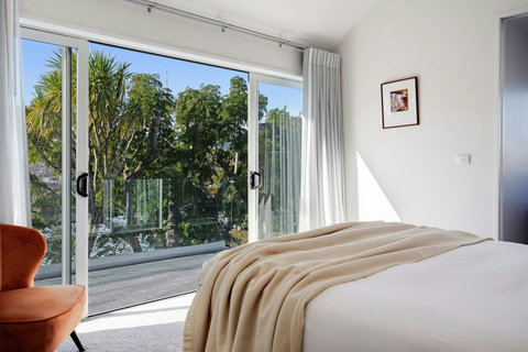 The main bedroom is located upstairs and has both a walk-in wardobe, ensuite bathroom and workspace.