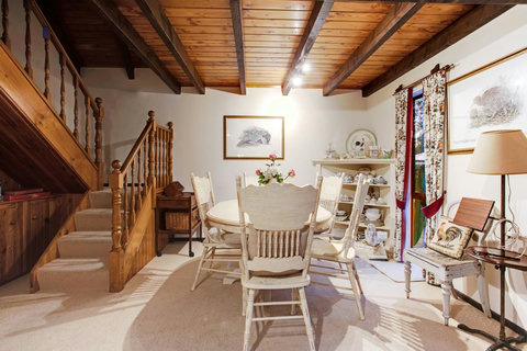 The formal dining room is personified by its country feel.