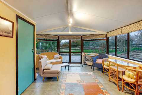 This room would be a lovely spot to read a book and look at the view.