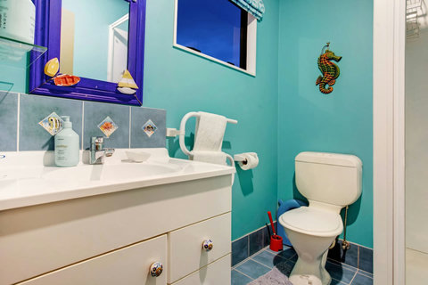 There is a shower, vanity and toilet in this bathroom.