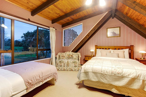 There is both a Queen and King-single bed in this upstairs bedroom.