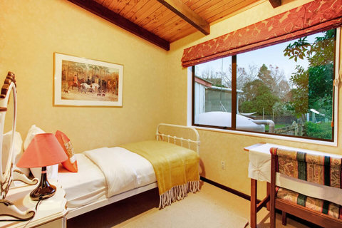 There is plenty of natural light that comes through the bedroom window.