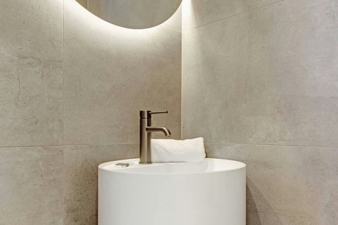 The wash-basin is a work of art with its circular design.