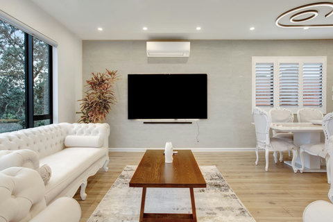 Relax on the couch and watch TV on the 85" screen.