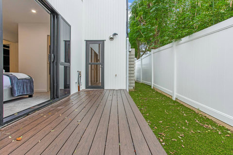 The balcony off the ground floor bedroom with the lawn.