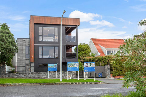 View of the outside of the home with this unit being number one on the block.