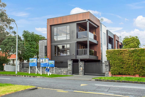 View of the outside of the home with this unit being number one on the block.