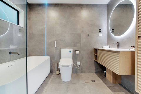 The ensuite bathroom has a lovely tub - perfect for soaking after a long day.