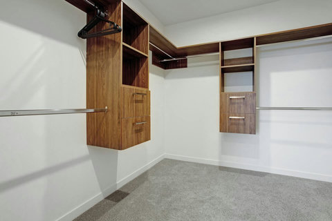 The walk-in wardrobe has plenty of storage space for all your personal belongings.