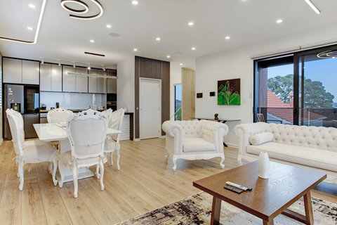 The open-plan living area has the kitchen, dining table and lounge area.