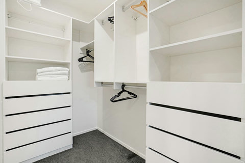 There is plenty of storage in the walk-in wardrobe for all your personal belongings.