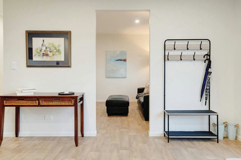 There is handy entry storage and a console table before heading into the second living room.