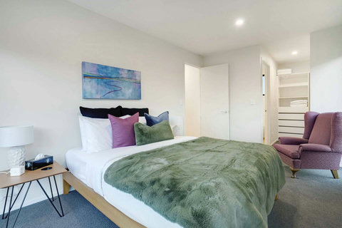 The main bedroom has a Queen sized bed, walk-in wardrobe and an ensuite bathroom.